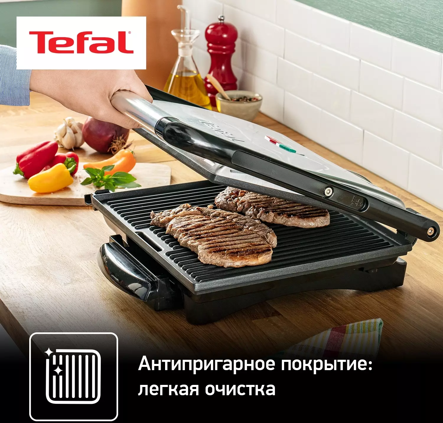 Обзор электрогриля Tefal GC241D38: стильное и функциональное решение для приготовления вкусных блюд дома в черном и серебристом цвете.